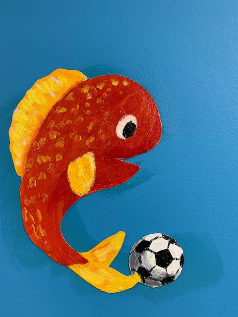 Illustration of fish with soccer ball