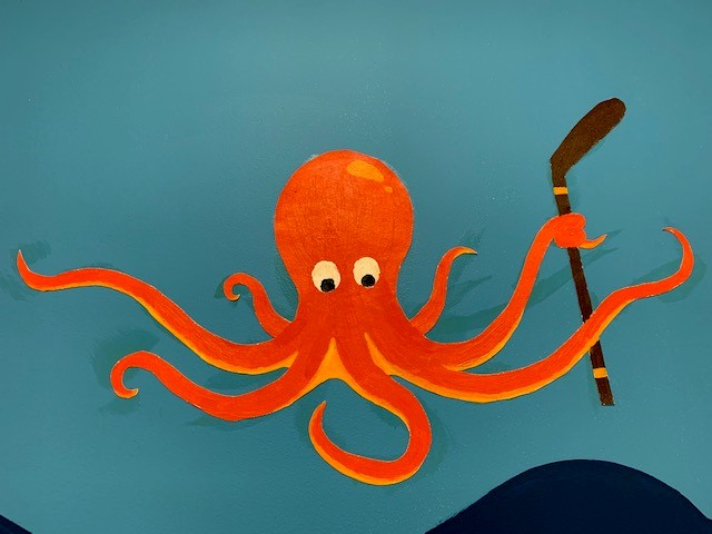 Illustration of octopus with hockey stick