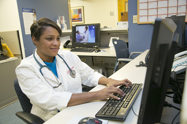 Kanecia Zimmerman at a desk