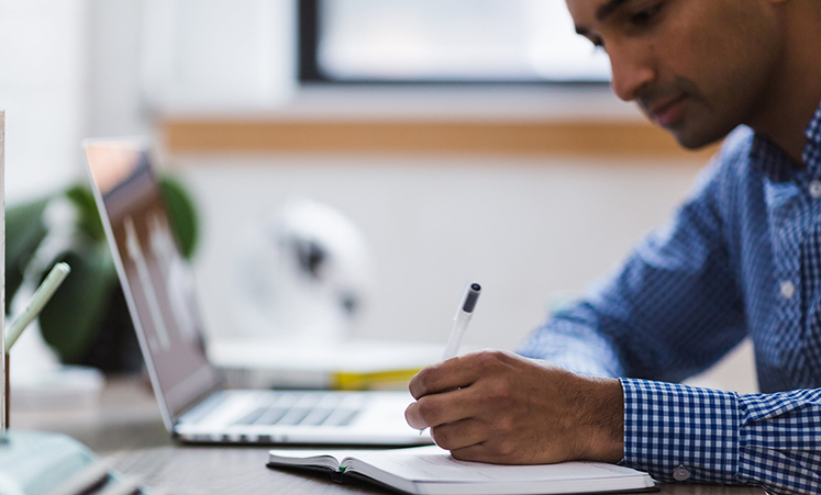 Student sitting at a laptop