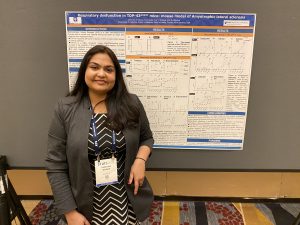 ElMallah Lab Members in front of Research Poster