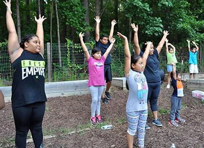Children stretching in a garden