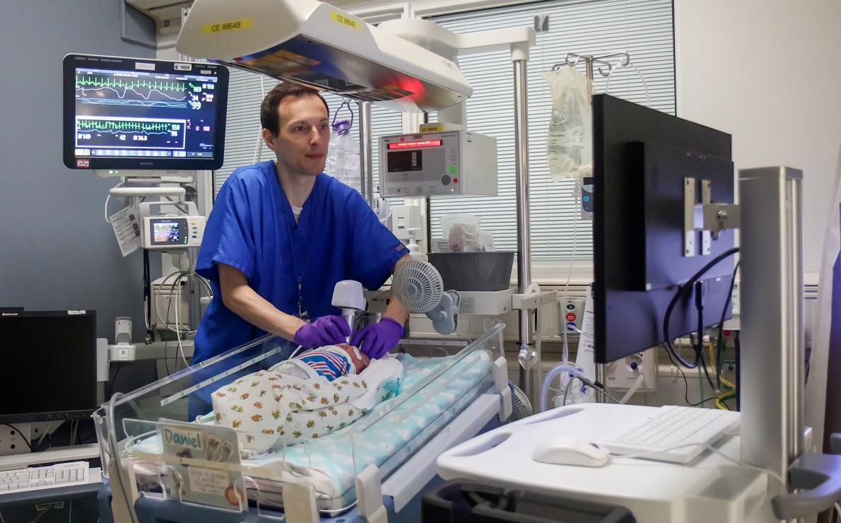 Baby having OCT imaging to determine eye and brain health