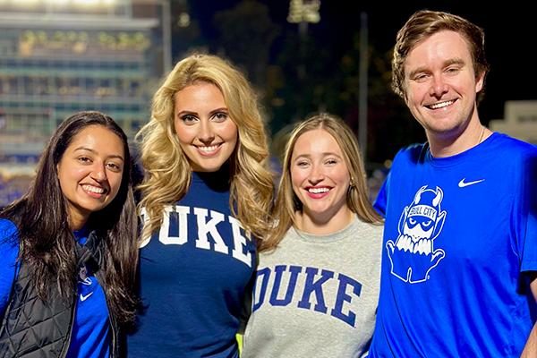 group of residents smiling at football game
