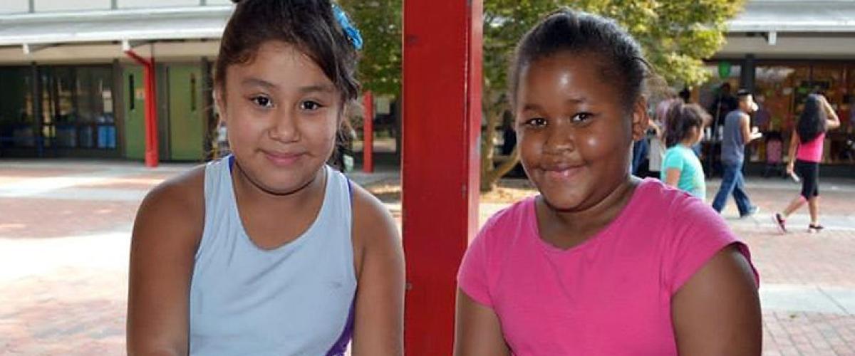 Two children smiling