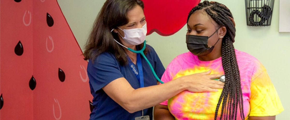 Doctor using a stethoscope on a patient