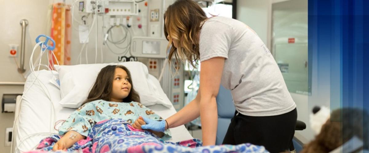 Provider holding the hand of a patient