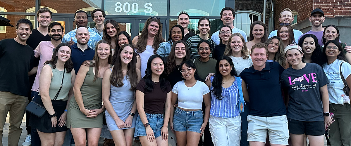 A large group of pediatric residents standing outside