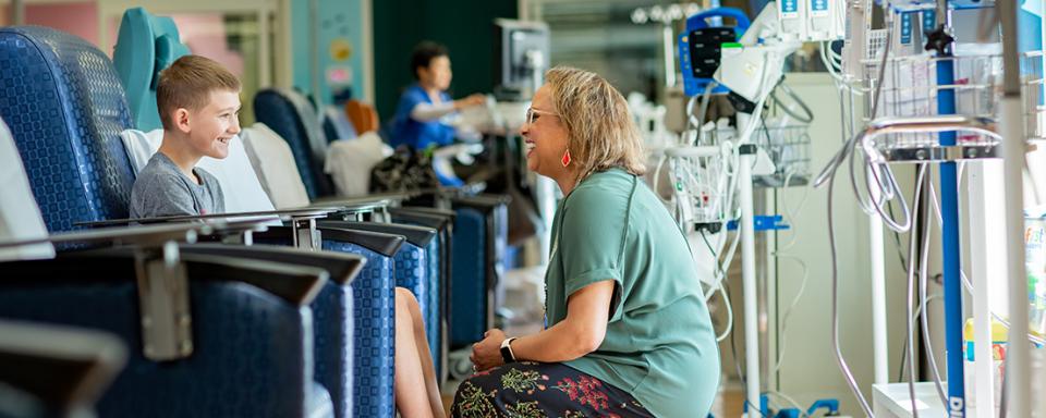 Nurse with rheumatology patient