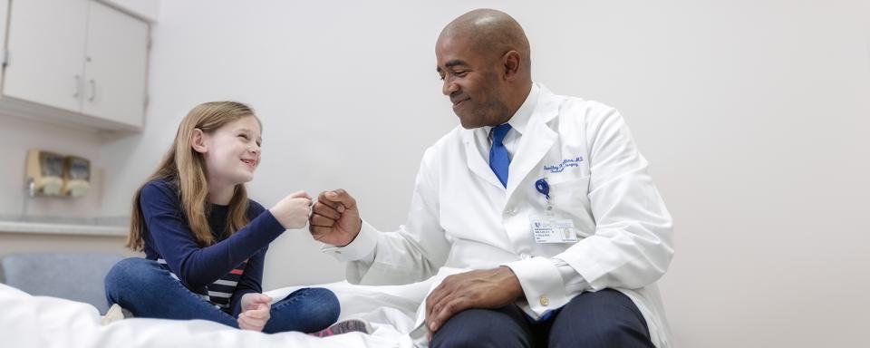 Doctor with pediatric patient