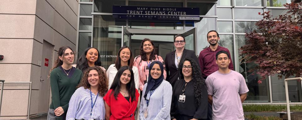 a group of people from ElMallah Lab standing outside, smiling